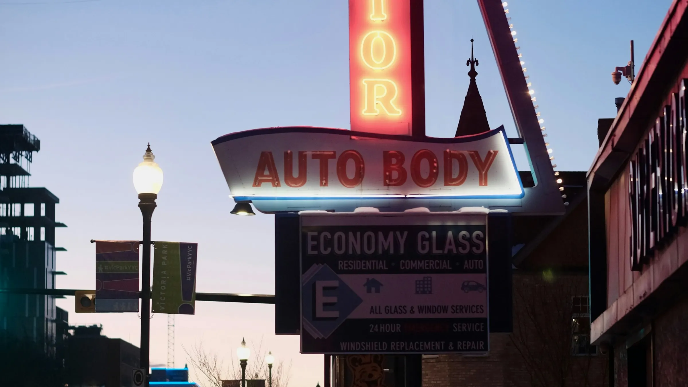 Auto glass shop exterior at dusk, Albuquerque