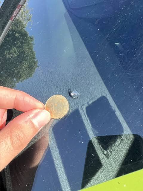 Partial bull's eye chip on auto glass